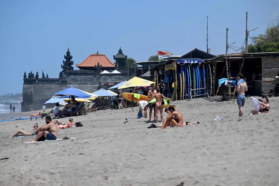 Tourists at a beach in Canggu. Bali attracted nearly three million foreign visitors in just the first six months of this year.