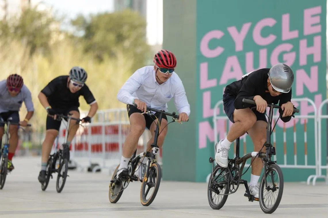 Cyclists racing around the circuit during the last Brompton World Championship in Shanghai in October 2025.