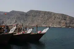 Boats docked in a fishing area in the Strait of Hormuz amid the US-Israeli conflict with Iran, in Musandam, Oman, March 2, 2026. The strait is the world’s most vital oil export route.