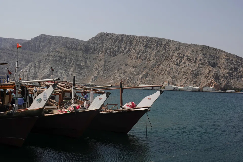 Boats docked in a fishing area in the Strait of Hormuz amid the US-Israeli conflict with Iran, in Musandam, Oman, March 2, 2026. The strait is the world’s most vital oil export route.
