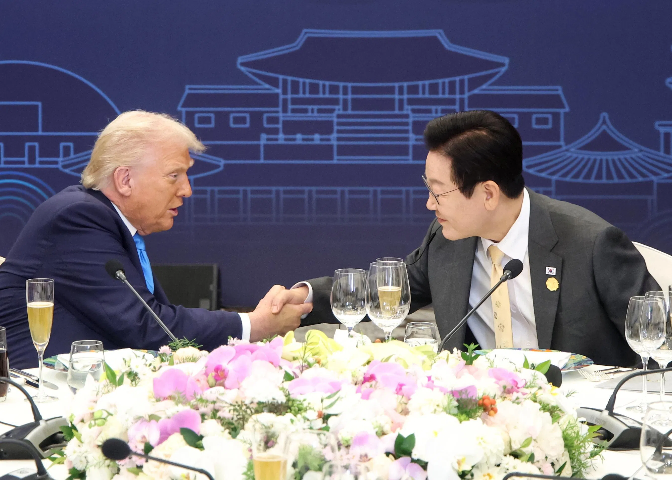 South Korean President Lee Jae Myung (right) and US President Donald Trump (left) attend a dinner at the Hilton Hotel in Gyeongju, South Korea, Oct 29, 2025. 