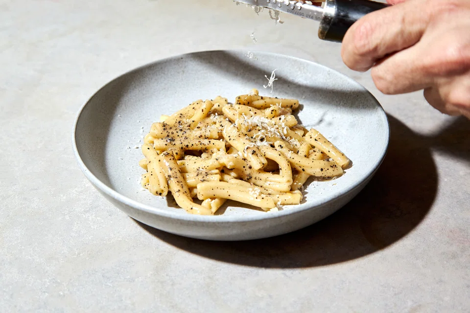 Caserecce pasta tossed in cheese and pepper.