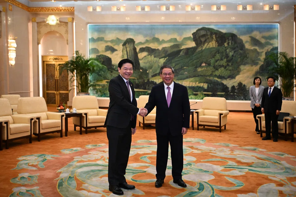 Singapore's Deputy Prime Minister Lawrence Wong (left) met with Chinese Premier Li Qiang at Great Hall of the People in Beijing, China on Dec 6. This is the second meeting  between both leaders this year.