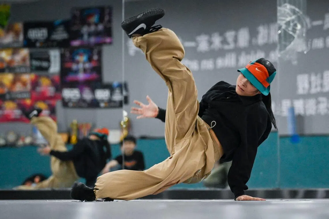 Guo Pu training at a breakdancing studio in Pingyi county, in China's Shandong province. She is a star in the country's breakdancing scene and aiming for gold at the World Championships in Japan this week. 