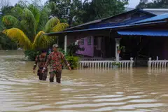 The floodwater was waist-high in some areas, which has affected 10 provinces in southern Thailand and eight states in Malaysia, including Selangor (above).