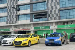 Industry observers say recent rule changes mean Grab could avoid big expenditures by building a taxi fleet from used or private-hire cars. 