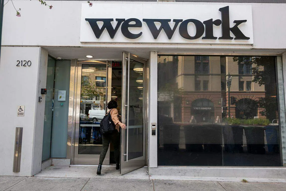 WeWork says its restructuring cuts its future rent obligations in half, or about US$12 billion overall.