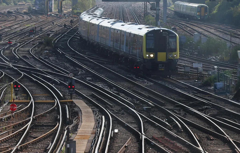 Trains travel towards Clapham Junction railway station in London, Britain, July 17, 2024. The legislation, if passed, will bring rail operators into public ownership when the private companies’ contracts expire - or sooner in the event of poor management - which will be managed by “Great British Railways”.