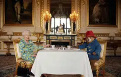At a star-studded music concert outside Buckingham Palace on Saturday, Queen Elizabeth put in a surprise on-screen appearance, taking tea with the beloved children’s book and film character Paddington Bear.