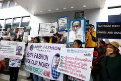 Thai workers from three textile factories that they say were closed in 2023 at a protest calling for unpaid salaries and severance pay amid a wave of factory closures in the country. 