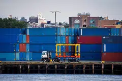 Shipping containers are stacked on a pier at the Red Hook Terminal in Brooklyn, New York, Sept 20, 2024. Tens of thousands of port workers stand poised to walk off the job in a stoppage that would also affect myriad other industries from trucking to retail to rail just weeks before the 2024 presidential election.