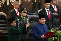 Indonesia's new President Prabowo Subianto taking the oath of office in Jakarta. He has already begun work on a free lunch programme that was a key plank of his campaign. 