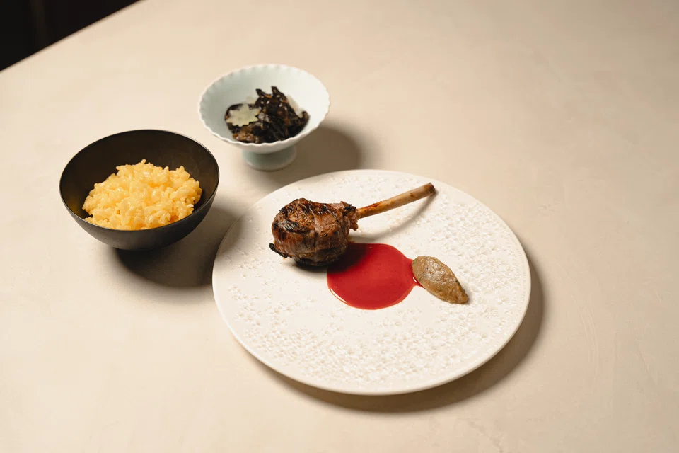 Juicy lamb chop served with fried rice and pickled black fungus.