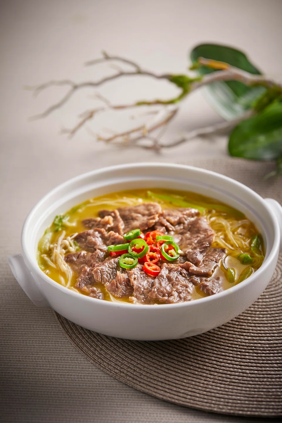 Sliced Angus beef in a savoury tangy broth.