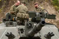 Britain's Prince William speaking to soldiers while visiting British service personnel at the Tapa Army Base, northern Estonia, in March. Unlike social expenditure, defence spending faces little political resistance. 