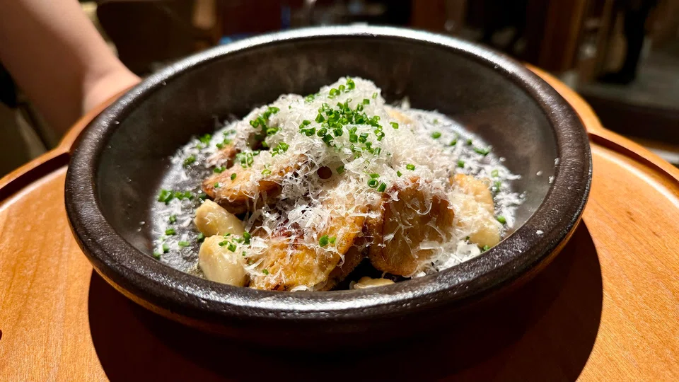 The butter-grilled Jeju abalone topped with grated cheese.