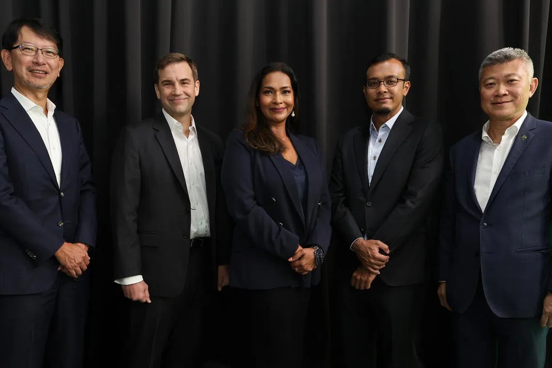 Participants at the panel discussion said South-east Asia's large population will create demand for new digital products and services. From left: Takeshi Sasaki, partner at Japanese private equity firm Advantage Partner; Geoff Howie, market strategist at the Singapore Exchange; Anita Gabriel, senior correspondent at BT; Khairul Anwar, director for South-east Asia at Enterprise Singapore; and Gregory Seow, global banking head and global head of financial institutions group at Maybank Singapore.
