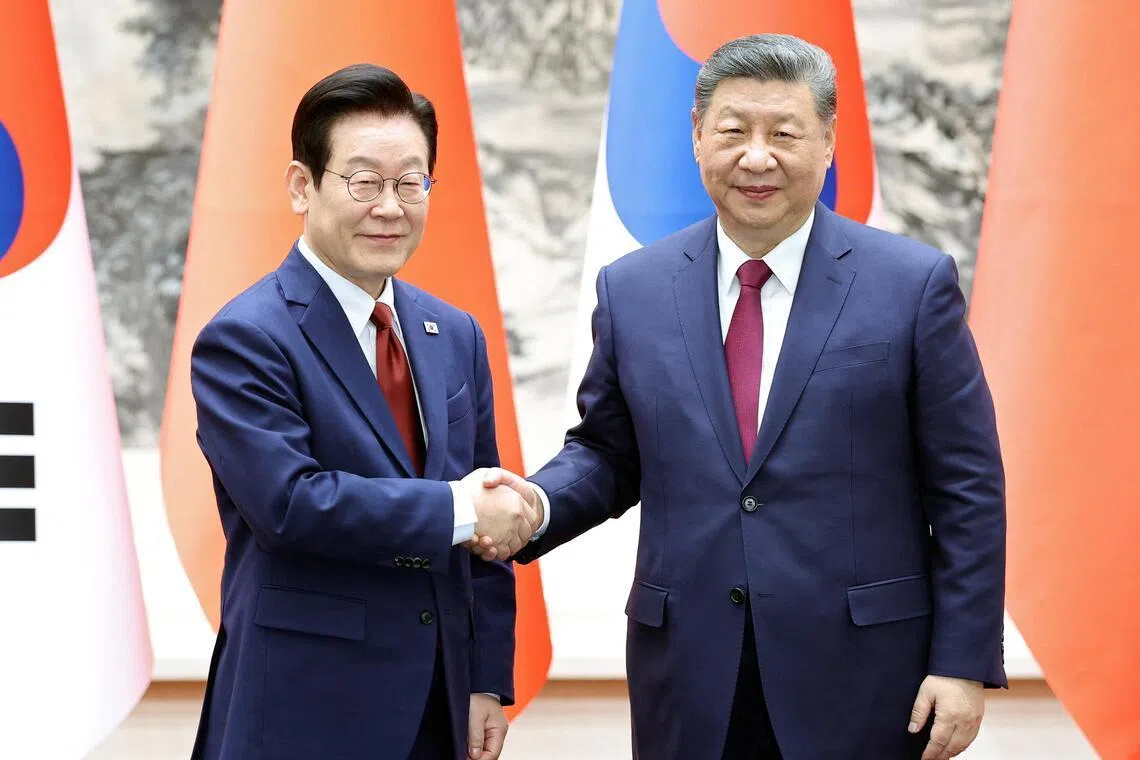 South Korean President Lee Jae-myung (left) and Chinese President Xi Jinping reaffirmed bilateral ties at their summit in Beijing.