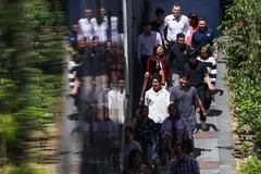 Singapore can build a future where artificial intelligence benefits both the economy and society by adopting AI-driven business transformation, prioritising human-centred economic growth, and focusing on talent development.