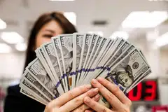 Money is an undeniable asset when you are starting out  – but it could turn into a liability in your later years, argue the authors.