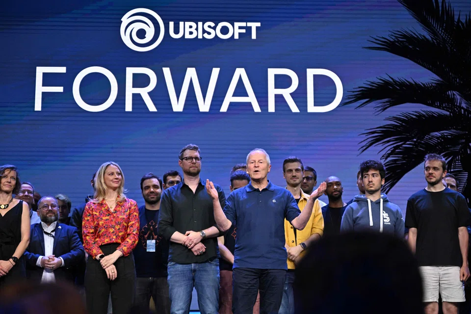 Ubisoft CEO Yves Guillemot (centre) said generative AI, or Gen AI, could make open-world games like Ubisoft’s blockbuster "Assassin’s Creed" franchise feel even “more alive.”