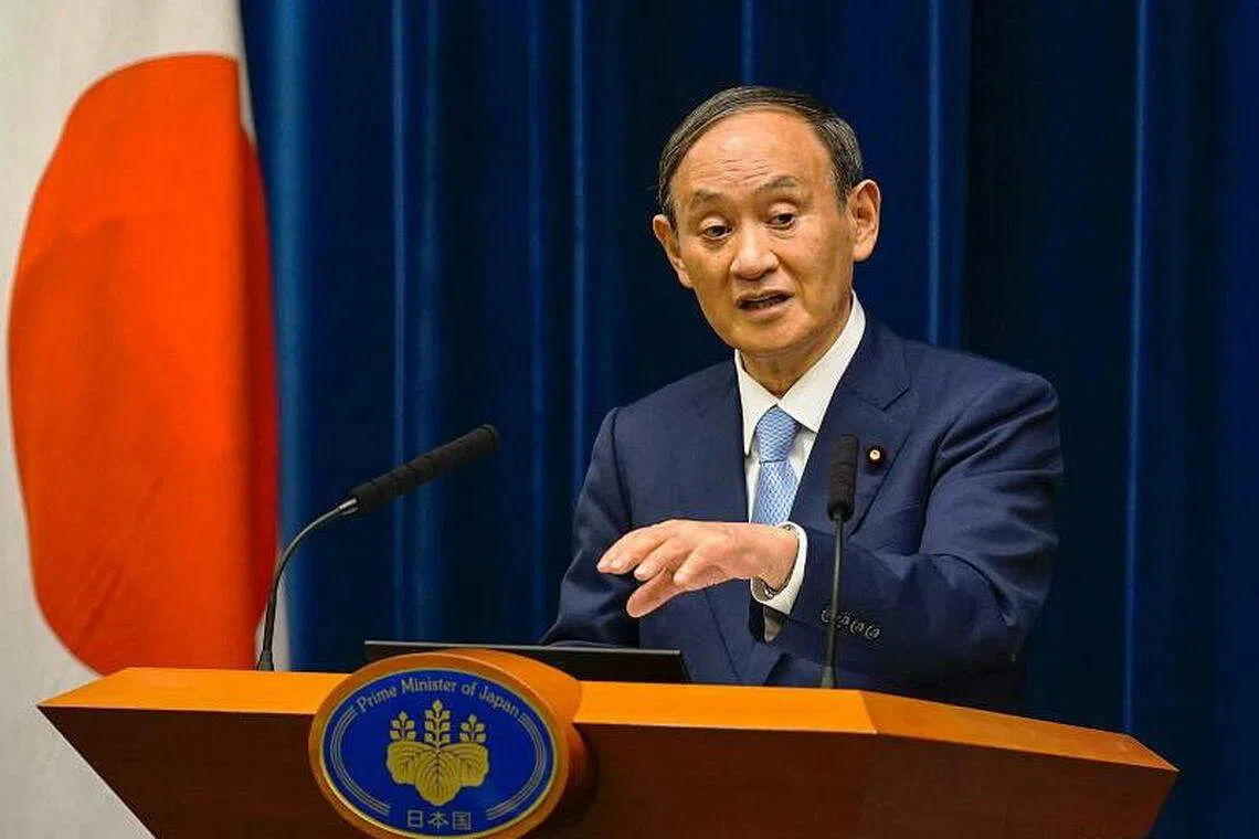 Japan firms want Suga out of office, Reuters poll shows