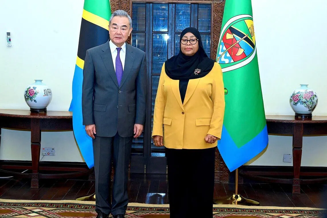 (From right) Tanzania President Samia Suluhu Hassan poses for a photograph with Chinese Foreign Minister Wang Yi in Dar es Salaam, Tanzania, Jan 10, 2026. 