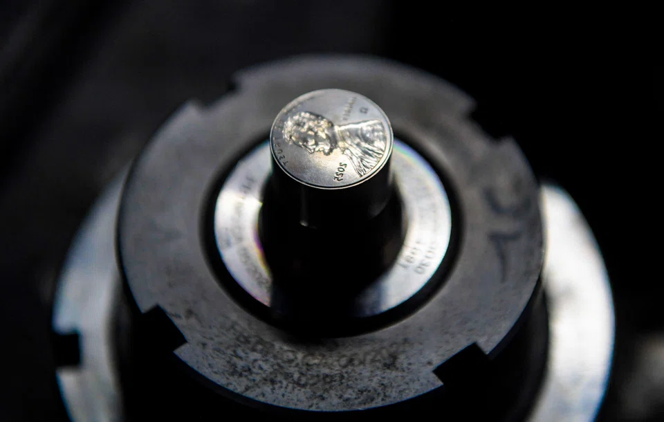 The dies used to press the last pennies sit on display at the US Mint on November 12, 2025 in Philadelphia, Pennsylvania. 