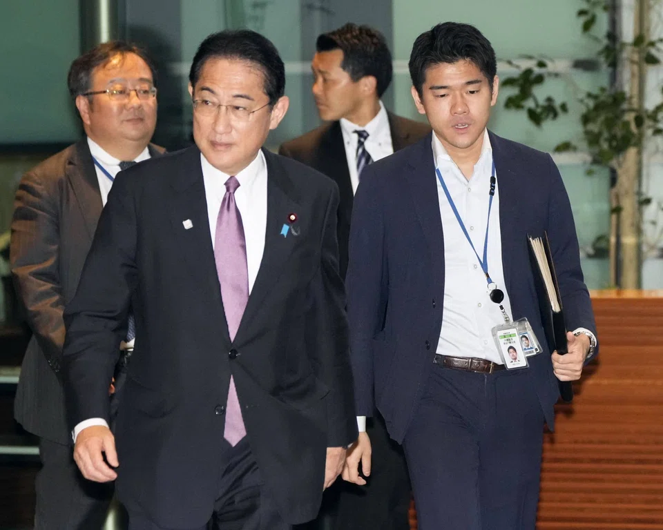 A magazine had published photos of Shotaro Kishida (right) posing in official spaces during a party, including on the stairs where new Cabinet ministers are usually photographed to mark their appointment. 