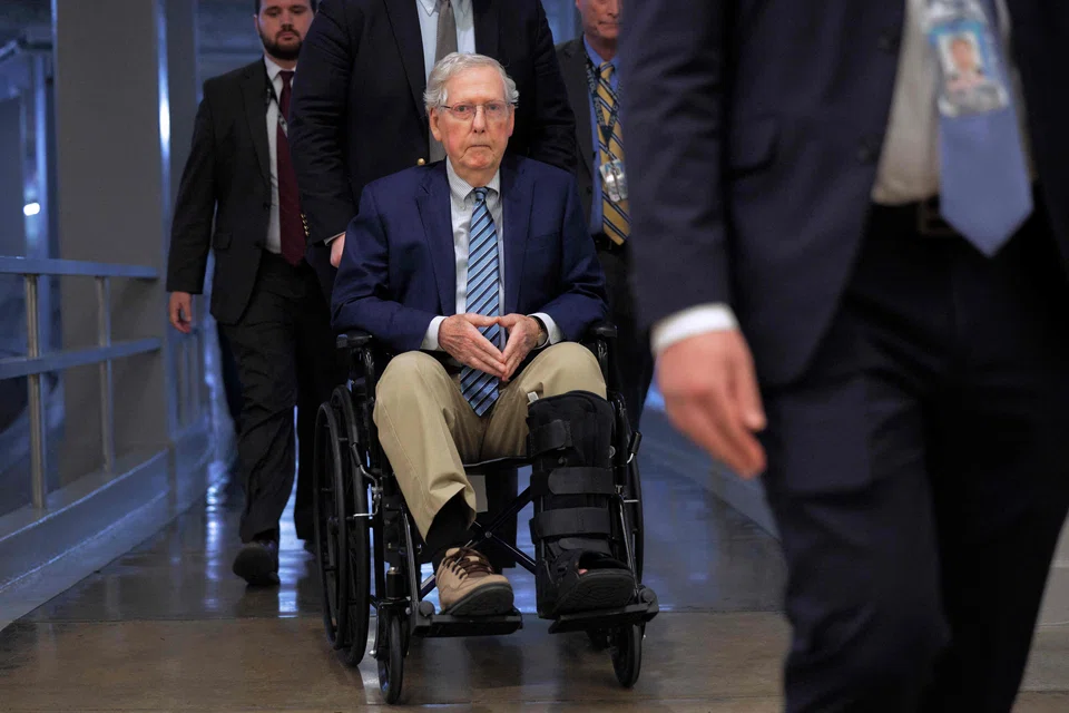 US Senator Mitch McConnell is pushed in a wheelchair as he heads to vote at the Capitol in Washington, D.C., Feb 18, 2025. McConnell announced on Thursday he would not seek reelection to the Senate.