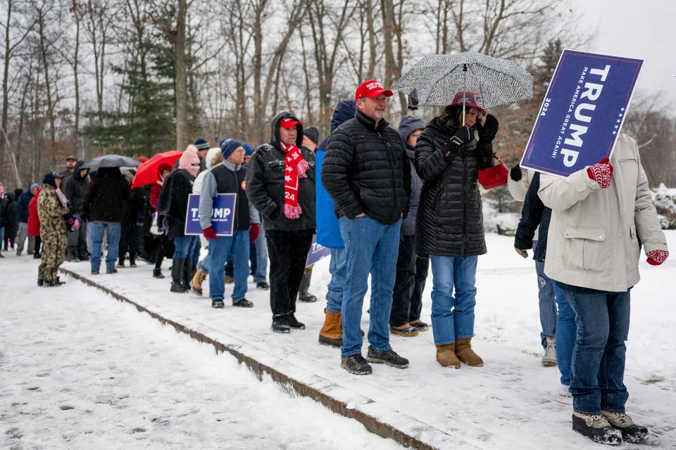 Supporters waiting for presidential candidate Donald Trump's rally in New Hampshire. Trump's victory in this week's Iowa caucuses has cemented his front-runner status among the other Republican candidates.