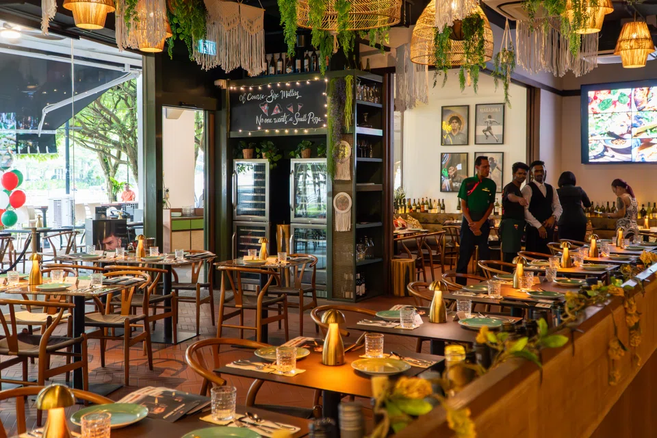 Vincenzo's cluttered interiors with wicker lamps retained from the previous restaurant.