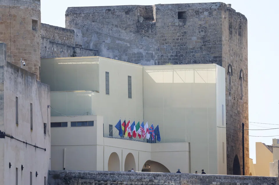 Flags of the G7 nations and the EU are seen at Castello Federiciano, the venue where the G7 summit's first dinner is scheduled to take place on Jun 13, in Brindisi, Italy.