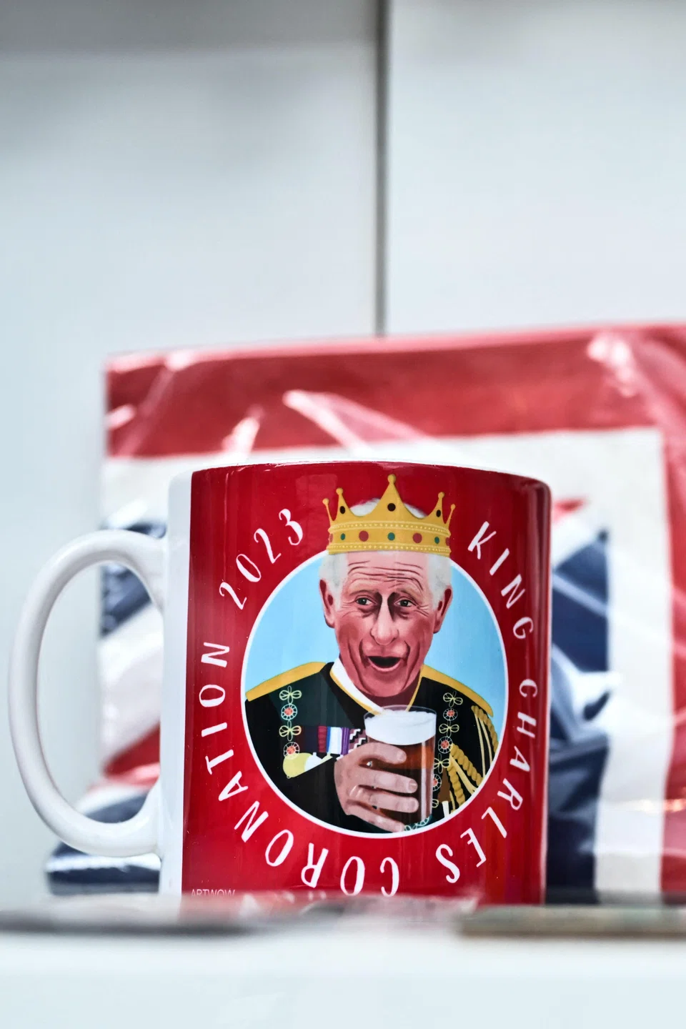 A mug picturing Britain's King Charles III is displayed in the front window of a shop ahead of the coronation weekend, in central London.