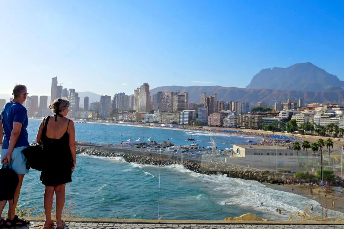 A former seafaring village of whitewashed houses and just 3,000 residents, Benidorm has mushroomed into a city of more than 100 skyscrapers whose population swells to 400,000 on peak August days.