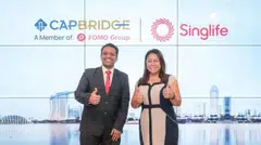 Varun Mittal, head of innovation and Ecosystem at Singlife (left), and Dr Janet Liu, chief executive officer at CapBridge. The collaboration expands CapBridge's range of products, and also deepens Singlife's engagement with SMEs.
