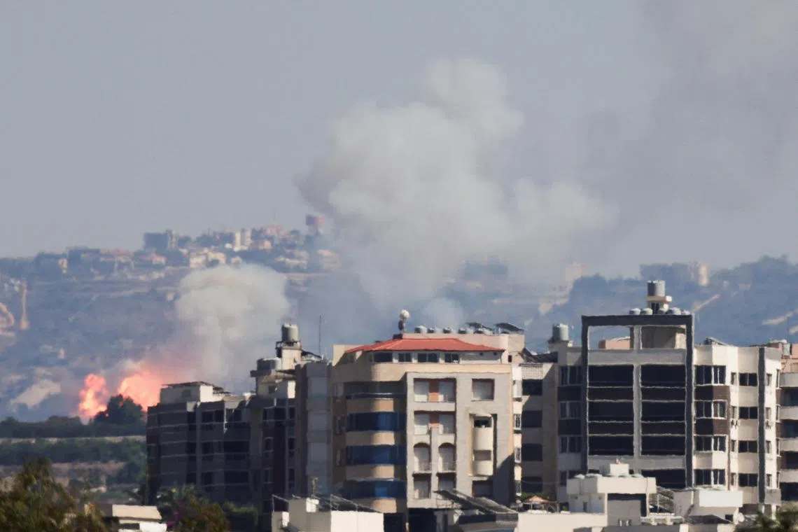 Smoke billows over southern Lebanon following an Israeli strike, amid ongoing cross-border hostilities between Hezbollah and Israeli forces.