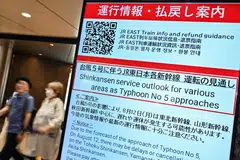 A sign alerting passengers of possible delays in northern Japan - due to "Typhoon No. 5", now classified as Severe Tropical Storm Maria - at an entrance to Japan Rail (JR) at Tokyo Station in central Tokyo, Japan, Aug 12, 2024. 