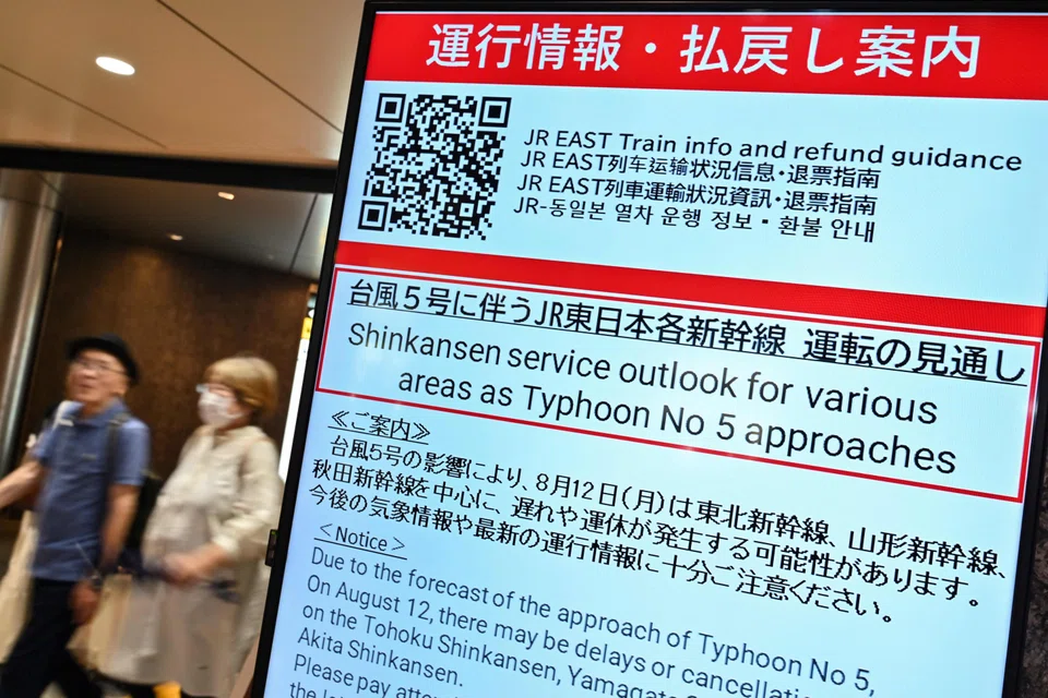 A sign alerting passengers of possible delays in northern Japan - due to "Typhoon No. 5", now classified as Severe Tropical Storm Maria - at an entrance to Japan Rail (JR) at Tokyo Station in central Tokyo, Japan, Aug 12, 2024. 