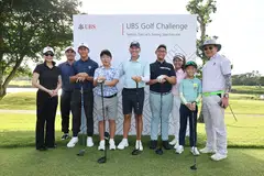 Sergio Garcia (fifth from left) with young golfers from Tanah Merah Country Club. With them is Patricia Quek, head of UBS Wealth Management Singapore (far left).