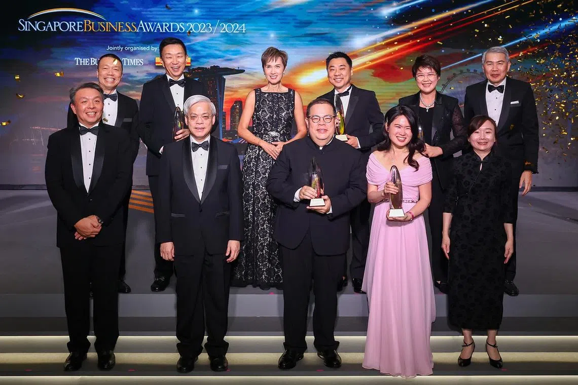 Front row, from left: Christopher Ong, senior vice-president & managing director, DHL Express Singapore; Chan Yeng Kit, board director, SPH Media; David Su, founding managing partner, Matrix Partners China; Adeline Sim, chief corporate officer, HRnet Group; Chen Huifen; editor, The Business Times. Back row, from left: Ken Lee, CEO Asia-Pacific, DHL Express; Loh Chin Hua, CEO, Keppel Ltd; Josephine Teo, Minister for Communications and Information; Charles Wong, co-founder & CEO, Charles & Keith Group; Chin Wei Jia, group CEO, HMI Medical; and Lim Ming Yan, chairman, Singapore Business Federation.