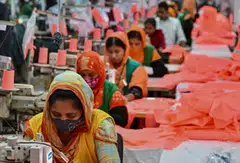 Garment workers sewing clothes at a Snowtex Group textile factory in Dhamrai, a sub-district in Dhaka. Taslima Akhter, from the Bangladesh Garment Workers’ Solidarity group, a labour rights organisation, says that “workers are struggling to maintain a minimum standard of living”.
