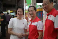 Leong Mun Wai (centre) of PSP meets Marymount SMC MP Gan Siow Huang (left) ahead of his walkabout on Saturday.