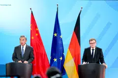 Chinese Foreign Minister Wang Yi (left) and German Foreign Minister Johann Wadephul at a joint press conference in Berlin, Germany, on Jul 3.
