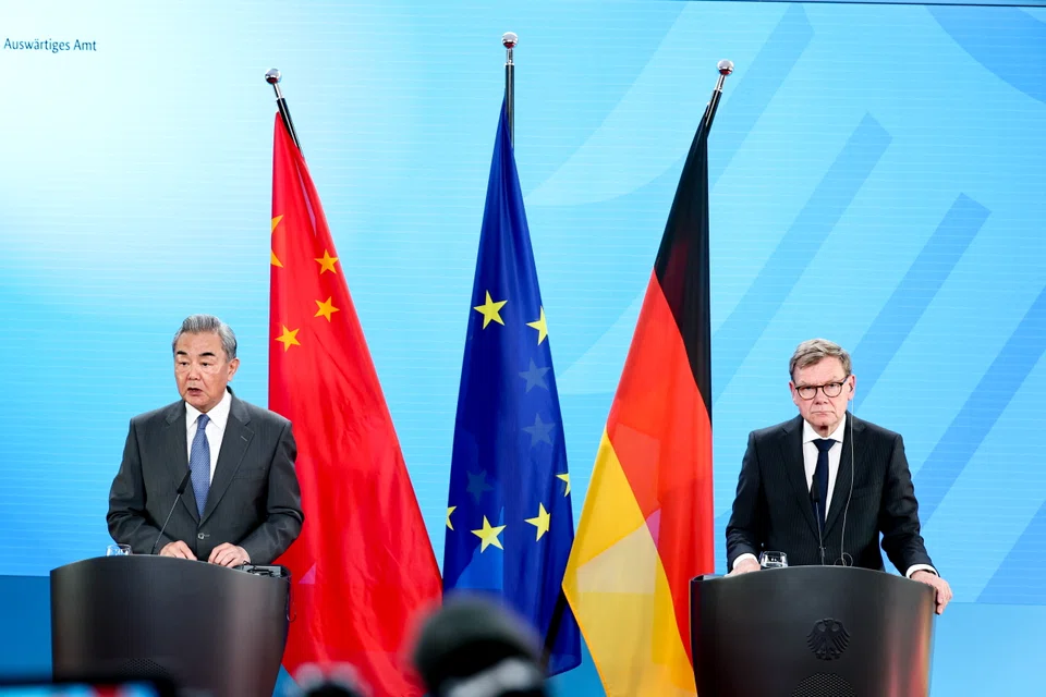Chinese Foreign Minister Wang Yi (left) and German Foreign Minister Johann Wadephul at a joint press conference in Berlin, Germany, on Jul 3.