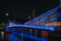 About 1,000 bamboo sticks are strung together to light up the Bridge of 1,000 Dreams.