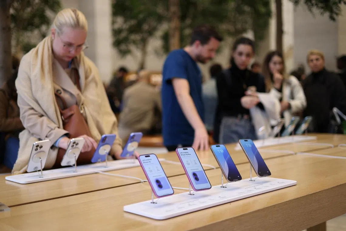 Apple iPhone 16 smartphones are displayed at a store in London, Britain, October 6, 2024. REUTERS/Hollie Adams