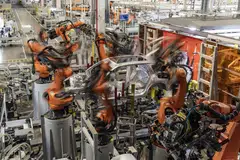 Robots and workers assemble electric vehicles at a new factory run by Chinese automaker Nio. Attitudes towards China have changed since businesses in the West realised it was evolving from being a supplier to a competitor. 