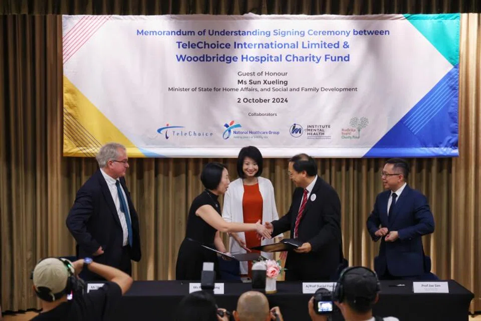 From left: Stephen Miller, president and group chief executive, ST Telemedia; Pauline Wong, chief executive, TeleChoice; Sun Xueling, Minister of State for Home Affairs and Social and Family Development; Prof Daniel Fung, chief executive, IMH; Prof Joe Sim, group chief executive, National Healthcare Group at the MOU signing.