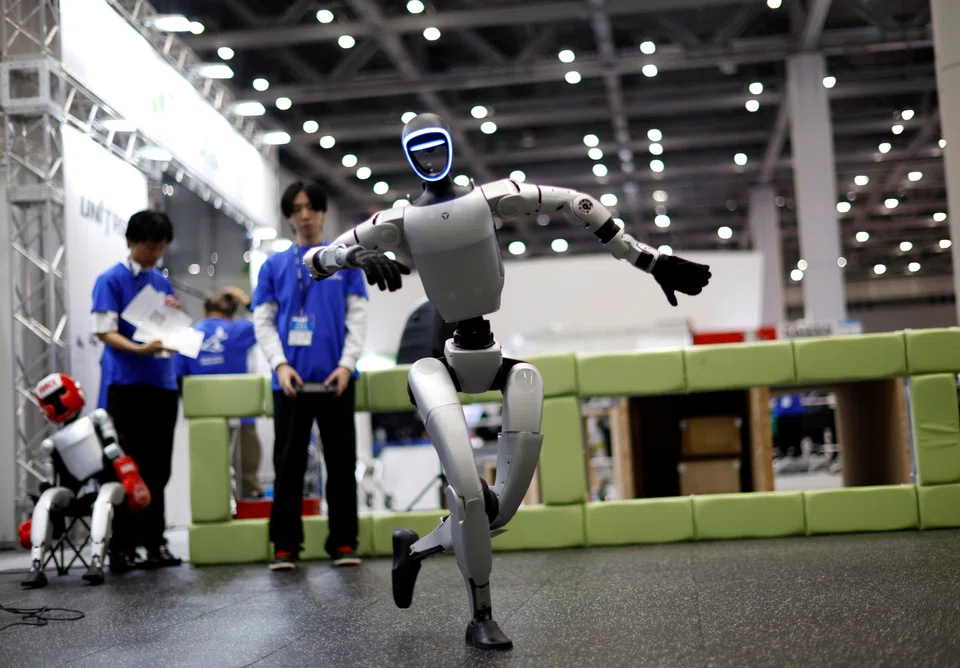 An android made by Unitree Robotics dancing at iREX 2025. When a robot-engendered crisis arises, there may be a temptation to frame the issue in the same terms as an immigration debate, says the writer.